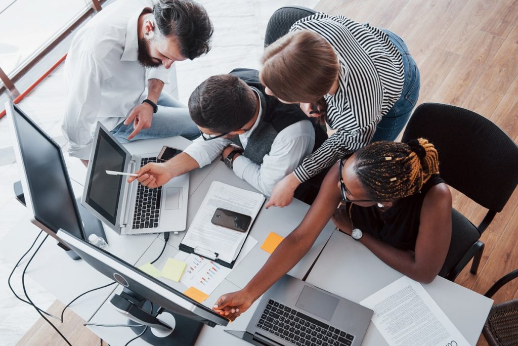 Group multinational busy people working office min