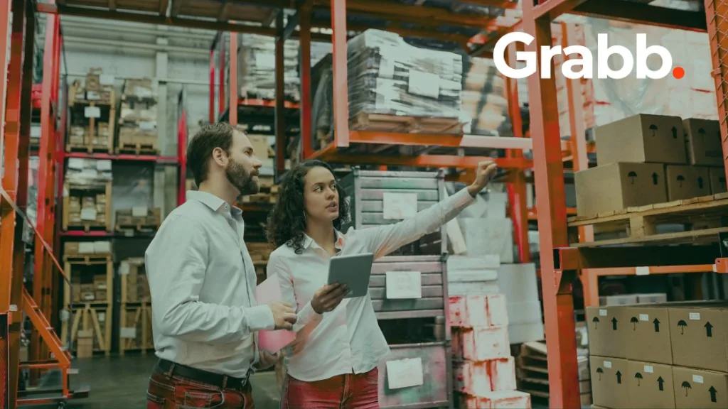 Commerce operations team discussing inventory and execution in a distribution warehouse